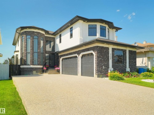 Modern exterior with a stone veneer and stucco facade - 3136 35 Avenue Nw, Edmonton, AB - Outdoor