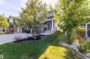 Two-story residence featuring dark siding and white trim - 491 Ebbers Way, Edmonton, AB 