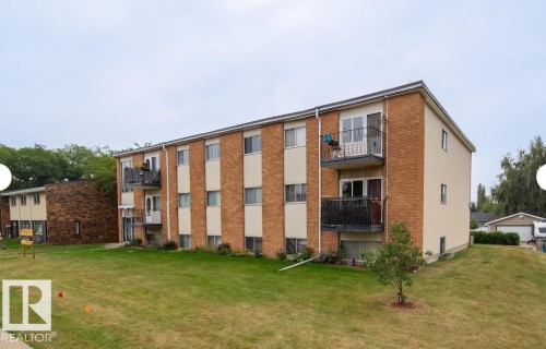 Multi-story residential building featuring brick and stucco siding - 3415 106 Avenue Northwest, Edmonton, AB - Outdoor