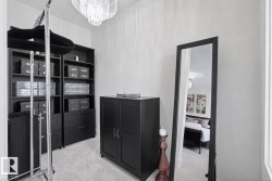 Custom closet system featuring built-in shelving, drawers, and cabinetry - 