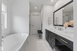 White freestanding bathtub with chrome fixtures - 