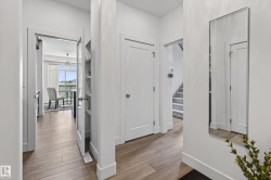 Light wood-finish flooring throughout the main entry - 