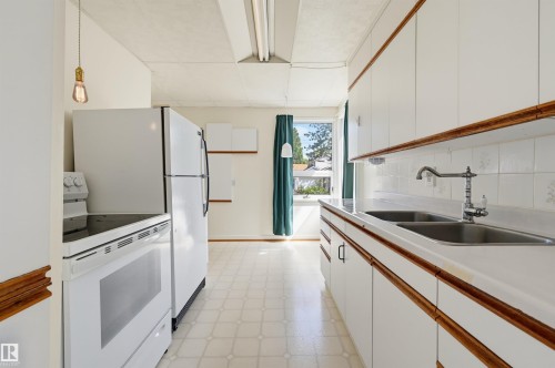 9728 89 Avenue Nw, Edmonton, AB - Indoor Photo Showing Kitchen With Double Sink