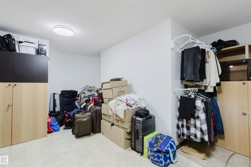 Recessed ceiling light fixture illuminating a neutral-toned room with light-colored flooring - 4103 Westcliff Heath Heath Sw, Edmonton, AB - Indoor