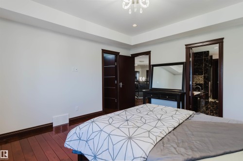 Recessed ceiling lighting, crown molding, and wood-finish flooring - 4103 Westcliff Heath Heath Sw, Edmonton, AB - Indoor Photo Showing Bedroom