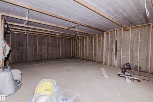 Unfinished basement with exposed ceiling joists and concrete flooring - 4103 Westcliff Heath Heath Sw, Edmonton, AB - Indoor Photo Showing Basement
