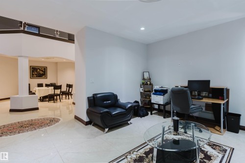 Open-concept main living area with neutral tile flooring throughout - 4103 Westcliff Heath Heath Sw, Edmonton, AB - Indoor