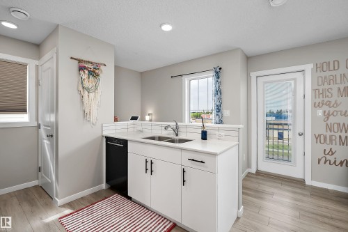 #65 50 Mclaughlin Dr, Spruce Grove, AB - Indoor Photo Showing Kitchen With Double Sink