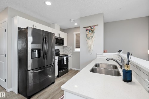 #65 50 Mclaughlin Dr, Spruce Grove, AB - Indoor Photo Showing Kitchen With Double Sink