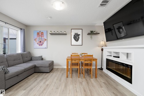 #65 50 Mclaughlin Dr, Spruce Grove, AB - Indoor Photo Showing Living Room With Fireplace