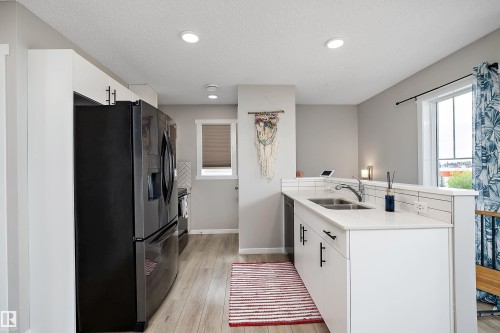 #65 50 Mclaughlin Dr, Spruce Grove, AB - Indoor Photo Showing Kitchen With Double Sink