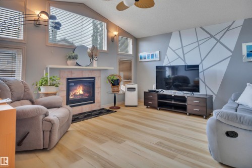 15 Douglas Crescent, Leduc, AB - Indoor Photo Showing Living Room With Fireplace