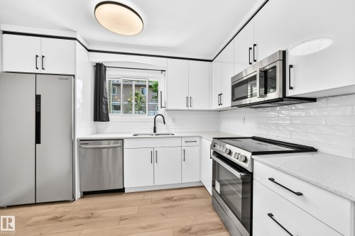 8033 27 Avenue Nw, Edmonton, AB - Indoor Photo Showing Kitchen With Stainless Steel Kitchen With Double Sink