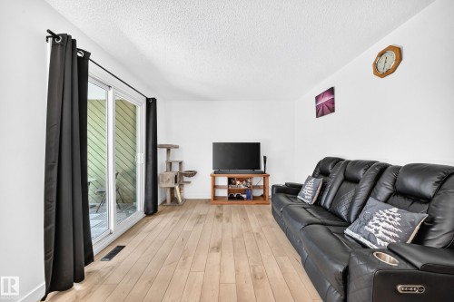 8033 27 Avenue Nw, Edmonton, AB - Indoor Photo Showing Living Room