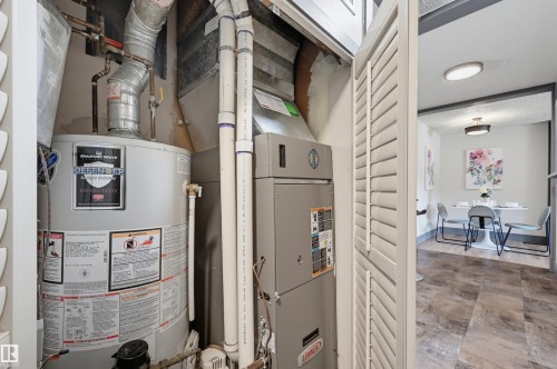 Utility closet featuring a water heater and HVAC system - 8716 130 Avenue Nw, Edmonton, AB - Indoor Photo Showing Basement