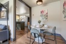 Dining area featuring wood-finish flooring and a ceiling-mounted light fixture - 8716 130 Avenue Nw, Edmonton, AB  - Indoor Photo Showing Dining Room 
