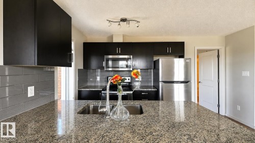 #419 142 Ebbers Bv Nw, Edmonton, AB - Indoor Photo Showing Kitchen With Double Sink With Upgraded Kitchen