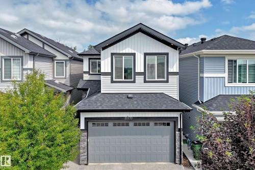 Contemporary exterior with varied siding, an attached garage, and multi-pane windows - 22270 99A Avenue Nw, Edmonton, AB - Outdoor