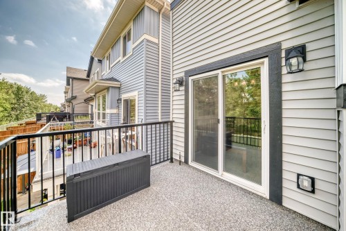 Private balcony featuring a textured concrete surface and black metal railings - 22270 99A Avenue Nw, Edmonton, AB - Outdoor With Deck Patio Veranda With Exterior
