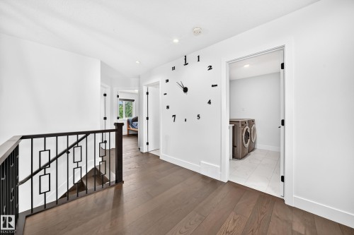 Hallway featuring dark wood-finish flooring, white walls, and recessed lighting - 22270 99A Avenue Nw, Edmonton, AB - Indoor Photo Showing Other Room