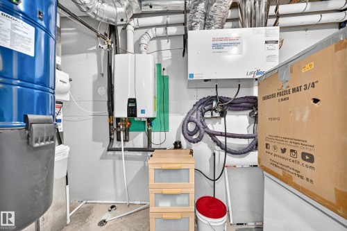 Tankless water heater installation - 22270 99A Avenue Nw, Edmonton, AB - Indoor Photo Showing Basement
