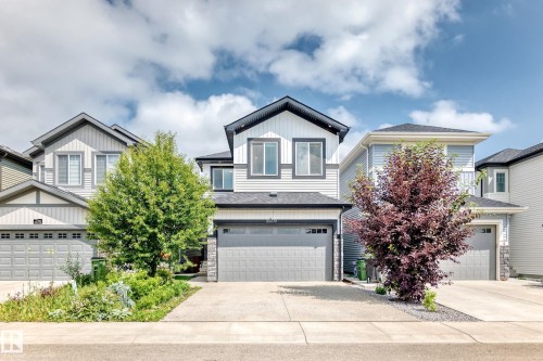 Two-story home featuring a combination of horizontal siding and vertical board and batten siding - 22270 99A Avenue Nw, Edmonton, AB - Outdoor With Facade