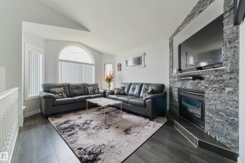 417 Hollick-Kenyon Road Nw, Edmonton, AB - Indoor Photo Showing Living Room With Fireplace