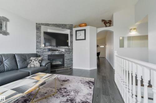 417 Hollick-Kenyon Road Nw, Edmonton, AB - Indoor Photo Showing Living Room With Fireplace
