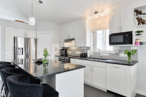 417 Hollick-Kenyon Road Nw, Edmonton, AB - Indoor Photo Showing Kitchen With Upgraded Kitchen
