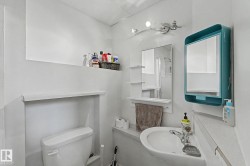 White ceramic wall-mounted sink with chrome faucet - 