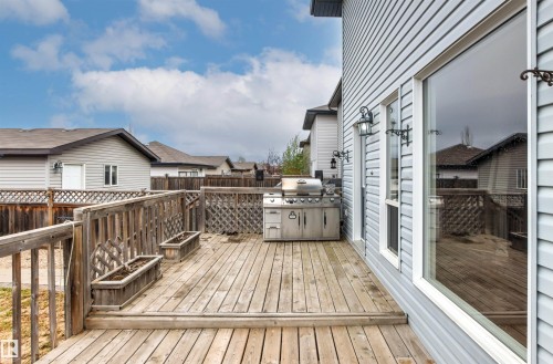 Wooden deck with railing, featuring a built-in outdoor cooking station - 1154 35A Avenue Nw, Edmonton, AB - Outdoor With Deck Patio Veranda With Exterior