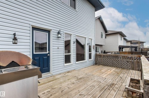Spacious wood deck with lattice railing - 1154 35A Avenue Nw, Edmonton, AB - Outdoor With Deck Patio Veranda With Exterior