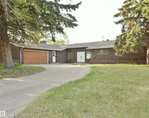 Mature landscaping allows this stunning home to blend into it's Gold Bar Ravine surroundings - 4108 106B Avenue, Edmonton, AB - Outdoor