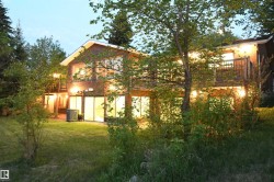 Woodburning fireplaces with log lighters are located on both the main floor, and in the cavernous family room on the walkout level with a full wet bar area - 