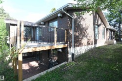 Two elevated decks serve the main floor, and create two covered patio spaces off of the walkout basement.  This deck is accessed from the dining area off the kitchen - 