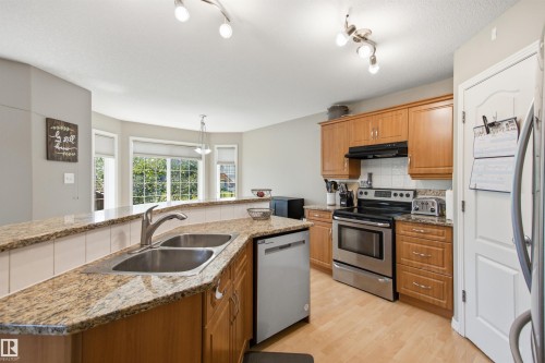 8203 5 Avenue Sw, Edmonton, AB - Indoor Photo Showing Kitchen With Stainless Steel Kitchen With Double Sink