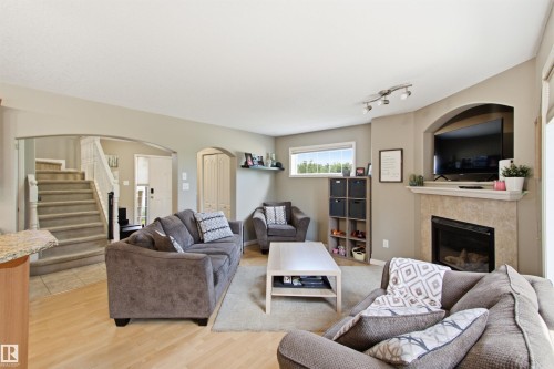 8203 5 Avenue Sw, Edmonton, AB - Indoor Photo Showing Living Room With Fireplace