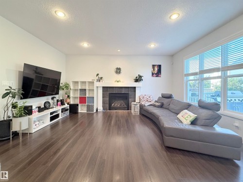 Living room - 5876 168 Avenue Nw, Edmonton, AB - Indoor Photo Showing Living Room With Fireplace