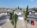 Contemporary two-story residence featuring a light gray exterior, white trim, and a gray shingle roof - 5876 168 Avenue Nw, Edmonton, AB  - Outdoor With Facade 