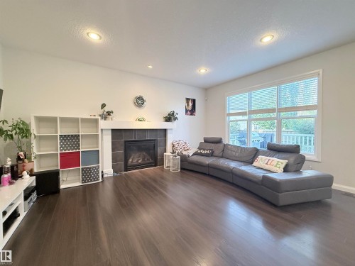 Living room - 5876 168 Avenue Nw, Edmonton, AB - Indoor Photo Showing Living Room With Fireplace