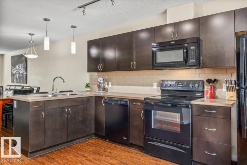 #40 9515 160 Av Nw, Edmonton, AB - Indoor Photo Showing Kitchen With Double Sink