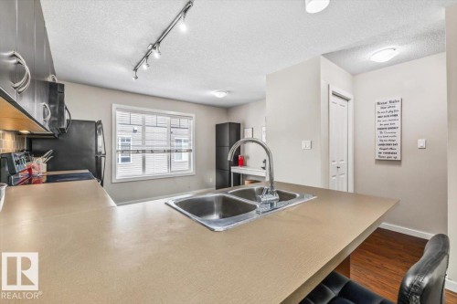 #40 9515 160 Av Nw, Edmonton, AB - Indoor Photo Showing Kitchen With Double Sink