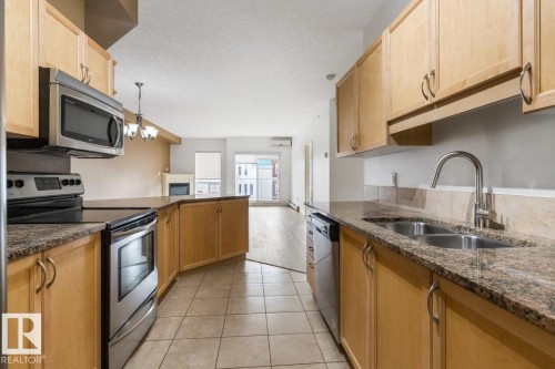 #407 5 Perron St, St. Albert, AB - Indoor Photo Showing Kitchen With Stainless Steel Kitchen With Double Sink