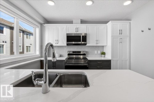 #63 16335 84 St Nw, Edmonton, AB - Indoor Photo Showing Kitchen With Double Sink