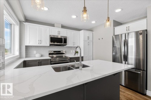 #63 16335 84 St Nw, Edmonton, AB - Indoor Photo Showing Kitchen With Double Sink With Upgraded Kitchen
