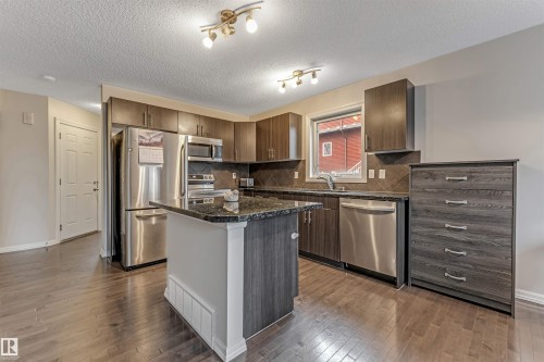 #10 5101 Soleil Bv, Beaumont, AB - Indoor Photo Showing Kitchen With Stainless Steel Kitchen