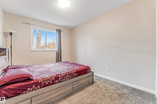 #10 5101 Soleil Bv, Beaumont, AB - Indoor Photo Showing Bedroom