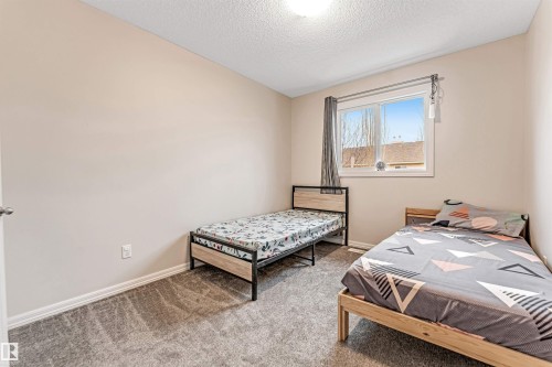 #10 5101 Soleil Bv, Beaumont, AB - Indoor Photo Showing Bedroom