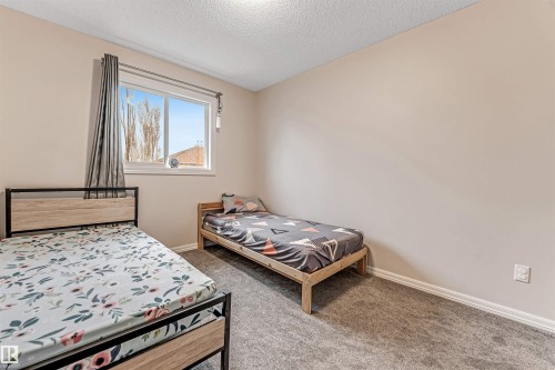 #10 5101 Soleil Bv, Beaumont, AB - Indoor Photo Showing Bedroom