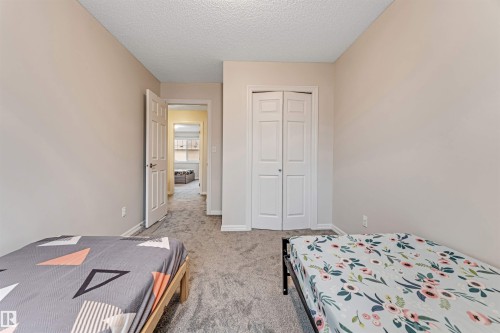#10 5101 Soleil Bv, Beaumont, AB - Indoor Photo Showing Bedroom